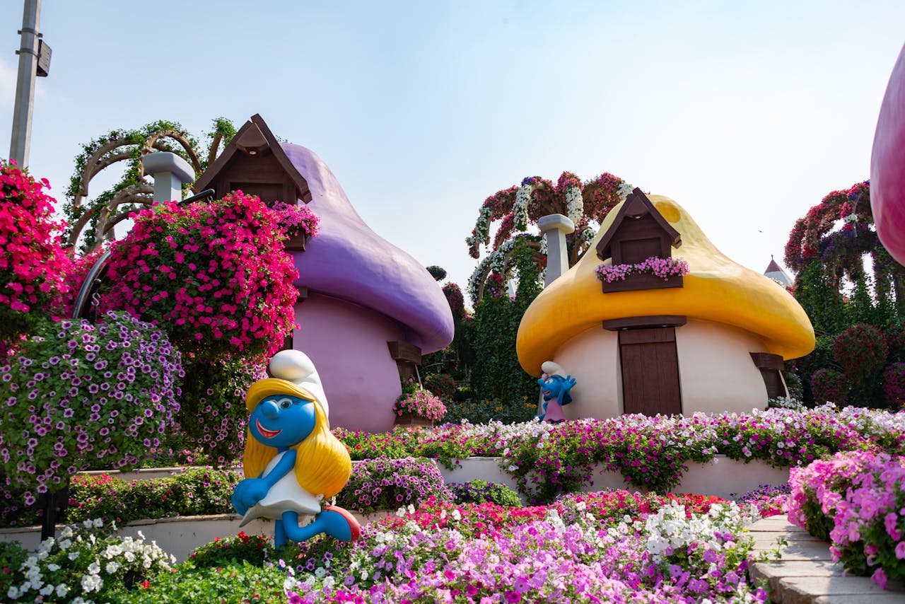 hero-gallery-02 Colorful Smurf-themed garden with vibrant flowers at Dubai Miracle Garden, ideal travel spot.