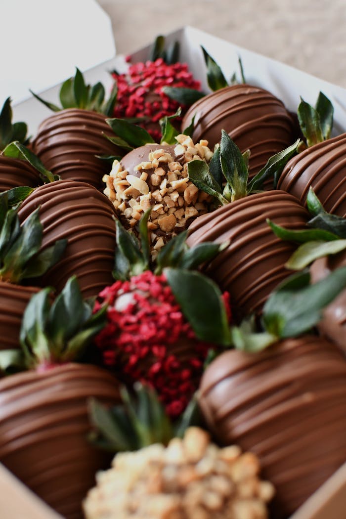 gallery-img-06 Close-up of assorted chocolate covered strawberries beautifully arranged in a box.